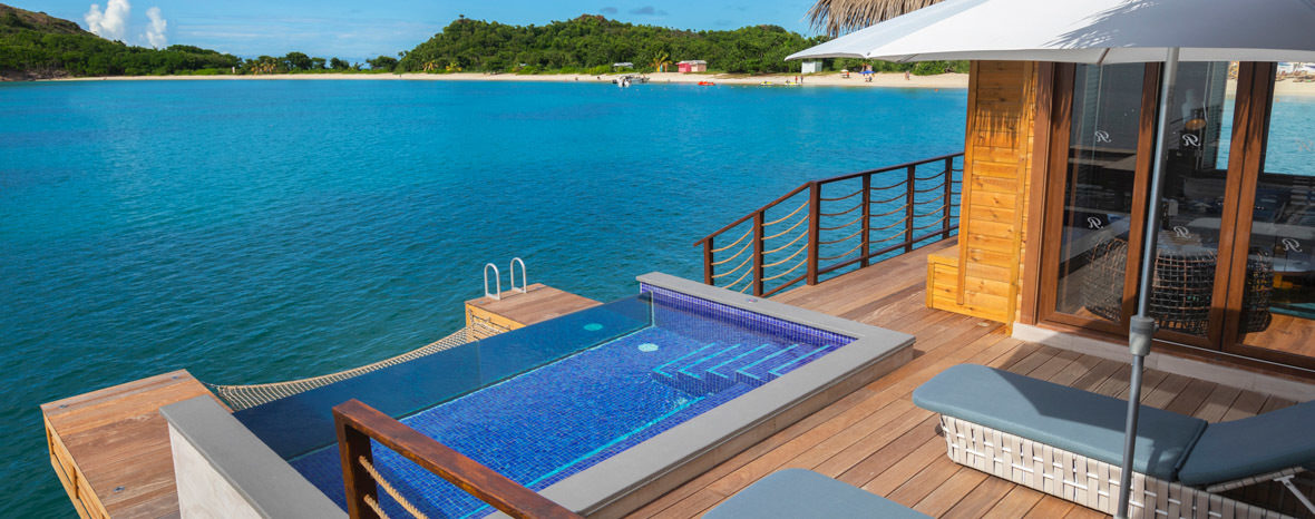 antigua huts on the water