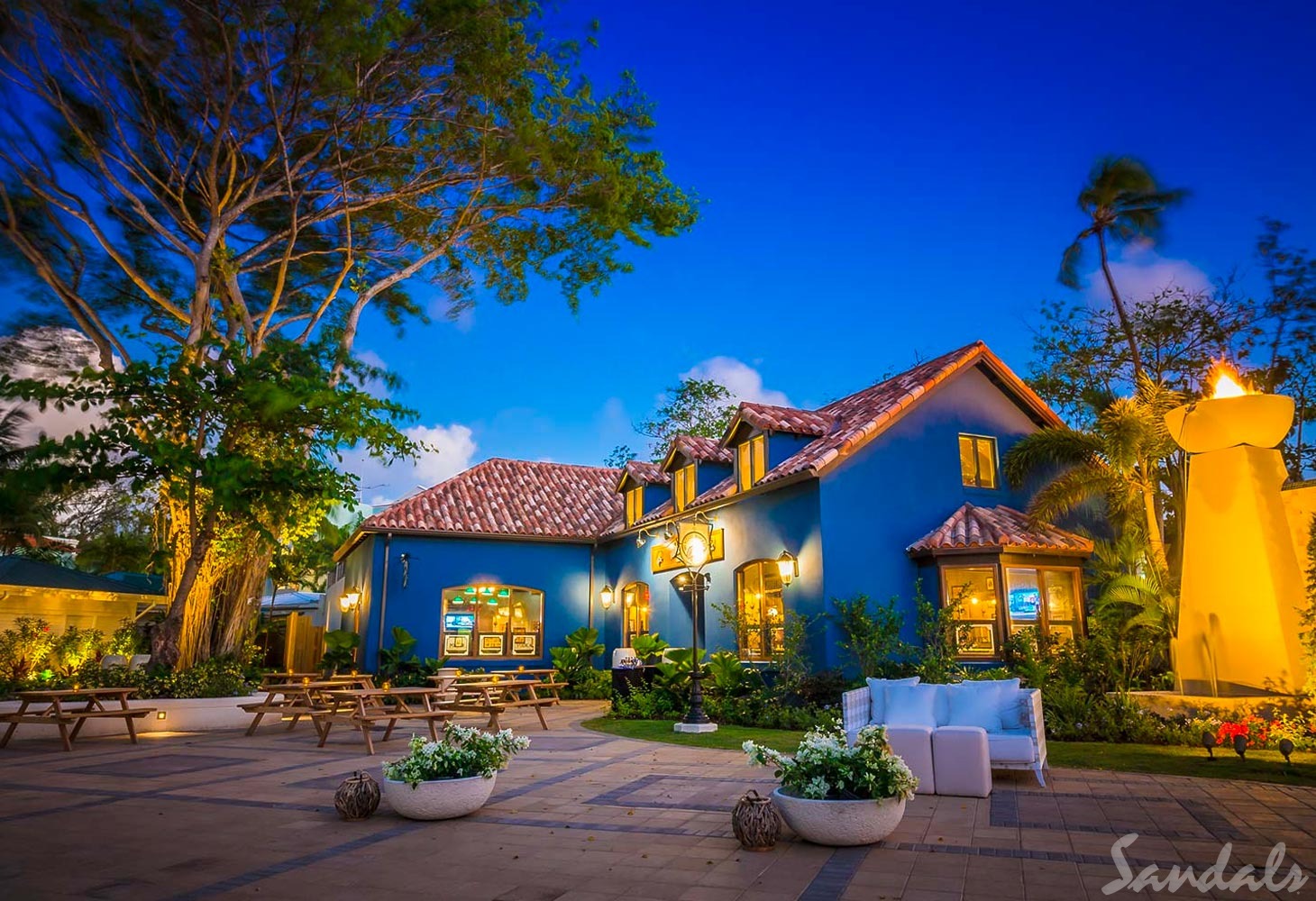 Sandals Barbados. Sandals Barbados. You will find the lovely Sandals Barbados in the St. Lawrence Gap area of Barbados. It is an all-inclusive resort with swim-up suites, free Wi-Fi, a dive shop and so much more for you to have a beautiful and amazing time. It is situated next door to another Sandals property - Sandals Royal Barbados. The two resorts share common grounds, so you get to stay at one and play at two. .