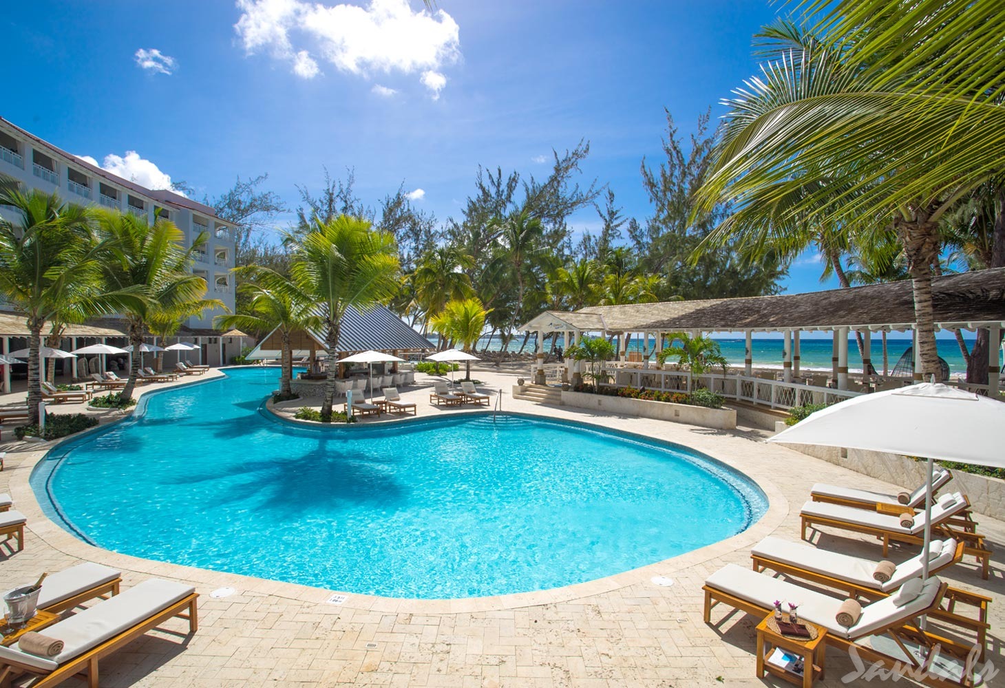 Sandals Barbados. Sandals Barbados. You will find the lovely Sandals Barbados in the St. Lawrence Gap area of Barbados. It is an all-inclusive resort with swim-up suites, free Wi-Fi, a dive shop and so much more for you to have a beautiful and amazing time. It is situated next door to another Sandals property - Sandals Royal Barbados. The two resorts share common grounds, so you get to stay at one and play at two. .