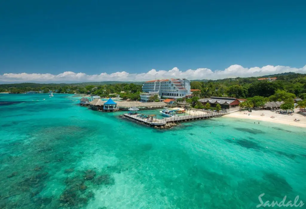 Sandals Ochi. Sandals Ochi. Sandals Ochi is the largest Sandals resort in the Caribbean. You will find it on over 100 acres of land overlooking the Caribbean. The resort has two sides, with rooms on the seaside and luxury villas offering all Butler service on the hillside. This large resort has so much to offer, making it one of our favorite Sandals Resorts..