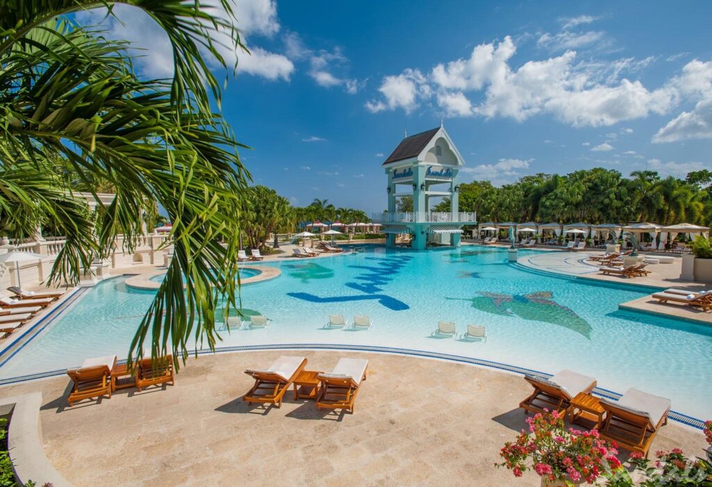 Sandals Ochi. Sandals Ochi. Sandals Ochi is the largest Sandals resort in the Caribbean. You will find it on over 100 acres of land overlooking the Caribbean. The resort has two sides, with rooms on the seaside and luxury villas offering all Butler service on the hillside. This large resort has so much to offer, making it one of our favorite Sandals Resorts..
