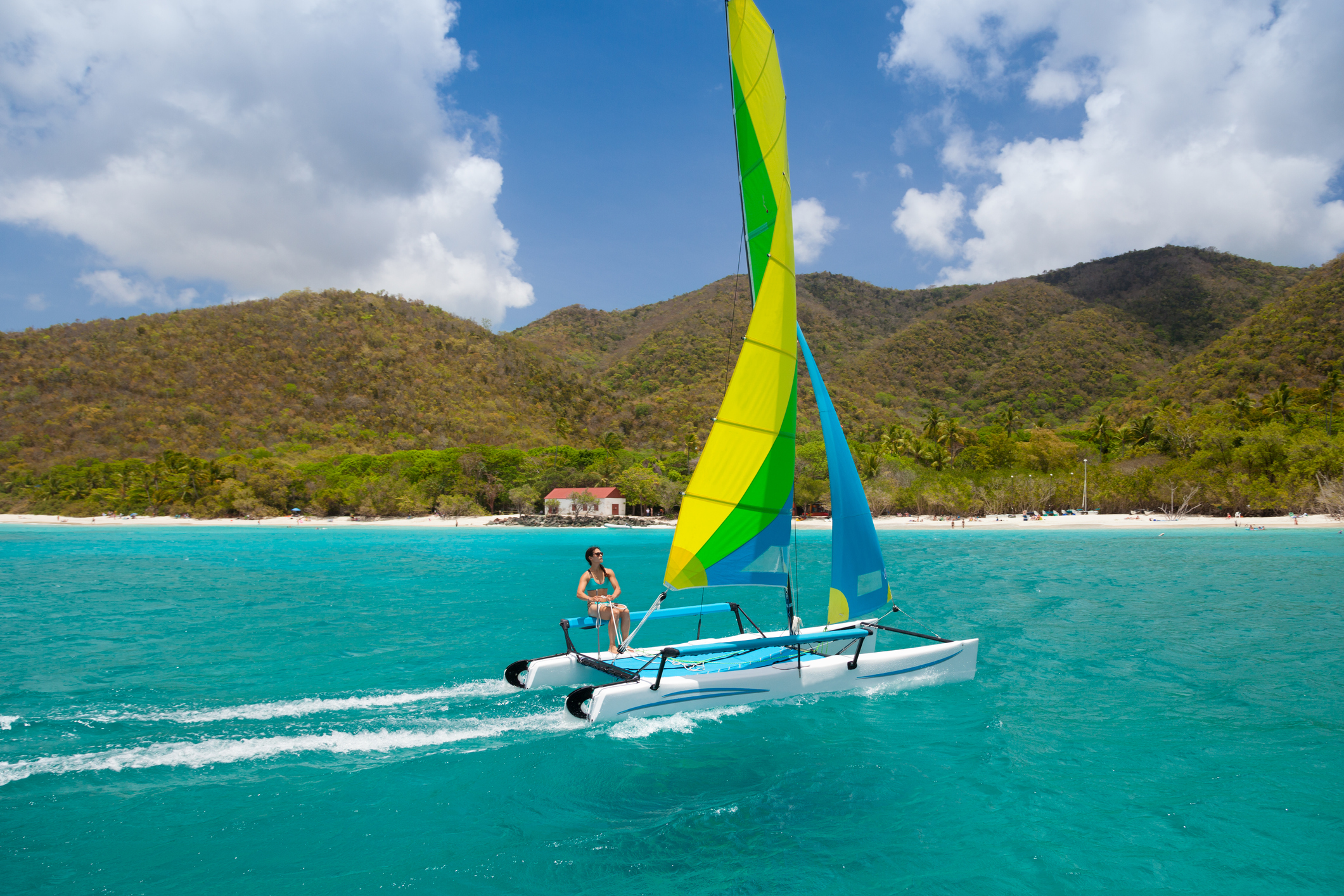 woman sailing a catamaran in Cinnamon Bay, St.John, USVI